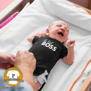 baby wearing a onesie that says "The Real Boss"