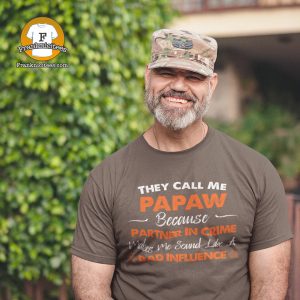 A military man wearing a t-shirt that says "They Call Me Papaw because calling me partner in crime makes me sound like a bad influence"