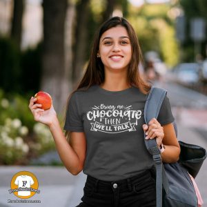 woman wearing a t-shirt that says "Bring Me Chocolate Then We'll Talk"