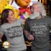 Couple wearing t-shirts that say "Old Enough To Know Better, Young Enough To Do It Anyway"