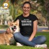 Woman with a corgi -wearing a t-shirt that says "It's Not Dog Hair It's Canine Confetti"